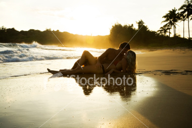 ist2_5551555_young_couple_at_sunset.jpg